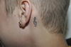 En las fotografías de los tatuajes se puede observar el rostro de Cristo, la corona de rey, una clave de sol, una flor, un pájaro, un tigre, el escudo de su equipo de hockey, un salmo y la palabra "Belive".