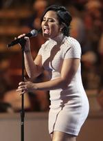 Singer Demi Lovato performs during the first day of the Democratic National Convention in Philadelphia , Monday, July 25, 2016. (AP Photo/Mary Altaffer)