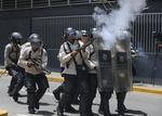 A demonstrator throws a bottle towards Venezuelan Bolivarian National police officers during a protest in Caracas, Venezuela, Saturday, April 8, 2017. Opponents of President Nicolas Maduro protested on the streets of the capital as part of an ongoing protest movement that shows little sign of losing steam. (AP Photo/Fernando Llano)
Caracas Venezuela Politcal Crisis VEN