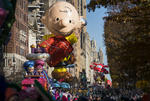 A Charlie Brown balloon moves along Central Park West during the Macy's Thanksgiving Day Parade in New York, Thursday, Nov. 23, 2017. (AP Photo/Craig Ruttle)