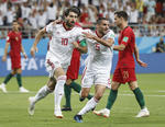 Karim Ansarifard festeja el empate de Irán.