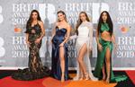 Artistas desfilan en la alfombra roja de los BRIT Awards