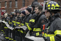 Firefighters work at the scene of a fatal fire at an apartment building in the Bronx on Sunday, Jan. 9, 2022, in New York. The majority of victims were suffering from severe smoke inhalation, FDNY Commissioner Daniel Nigro said. (AP Photo/Yuki Iwamura)