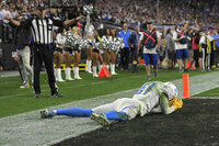 Los Angeles Chargers wide receiver Mike Williams (81) reacts after missing an attempted touchdown catch against the Las Vegas Raiders during overtime of an NFL football game, Sunday, Jan. 9, 2022, in Las Vegas. (AP Photo/David Becker)