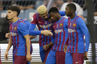 Barcelona's players celebrate a goal during the Spanish Super Cup semi final soccer match between Barcelona and Real Madrid at King Fahd stadium in Riyadh, Saudi Arabia, Wednesday, Jan. 12, 2022. (AP Photo/Hassan Ammar)