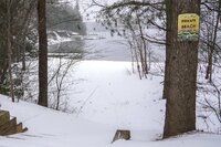 A beach is covered in snow on Lake James during a winter storm, Sunday, Jan. 16, 2022 in Morganton, N.C. Visibility was at a minimum due to snow, sleet and wind throughout the area. (AP Photo/Kathy Kmonicek)