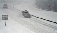 Virginia Department of Transportation snowplows attempt to keep I-581 clear for motorists during a winter storm on Sunday Jan. 16, 2022 in Roanoke, Va. (AP Photo/Don Petersen)