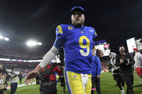 Los Angeles Rams kicker Matt Gay (8) celebrates as he leaves the field after the team defeated the Tampa Bay Buccaneers during an NFL divisional round playoff football game Sunday, Jan. 23, 2022, in Tampa, Fla. (AP Photo/Jason Behnken)
