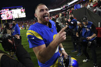 Los Angeles Rams quarterback Matthew Stafford (9) celebrates as he leaves the field after the team defeated the Tampa Bay Buccaneers during an NFL divisional round playoff football game Sunday, Jan. 23, 2022, in Tampa, Fla. (AP Photo/Jason Behnken)