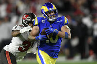 Los Angeles Rams quarterback Matthew Stafford (9) celebrates with wide receiver Cooper Kupp (10) after his reception against the Tampa Bay Buccaneers during the second half of an NFL divisional round playoff football game Sunday, Jan. 23, 2022, in Tampa, Fla. (AP Photo/Jason Behnken)