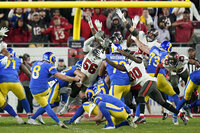 Los Angeles Rams players, including wide receiver Odell Beckham Jr. (3), long snapper Matthew Orzech (42) and wide receiver Van Jefferson (12) celebrate after defeating the Tampa Bay Buccaneers in a NFL divisional round playoff football game, Sunday, Jan. 23, 2022, in Tampa, Fla. (AP Photo/John Raoux)