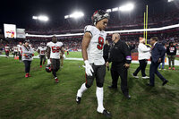 Tampa Bay Buccaneers tight end Rob Gronkowski (87) leaves the field after the team lost to the Los Angeles Rams during an NFL divisional round playoff football game Sunday, Jan. 23, 2022, in Tampa, Fla. (AP Photo/Mark LoMoglio)