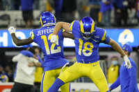 Los Angeles Rams' Van Jefferson, left, and Ben Skowronek celebrate after the NFC Championship NFL football game against the San Francisco 49ers Sunday, Jan. 30, 2022, in Inglewood, Calif. The Rams won 20-17 to advance to the Super Bowl. (AP Photo/Elaine Thompson)