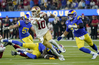 Los Angeles Rams defensive end Aaron Donald, middle, celebrates with teammates during the second half of the NFC Championship NFL football game against the San Francisco 49ers Sunday, Jan. 30, 2022, in Inglewood, Calif. (AP Photo/Jed Jacobsohn)