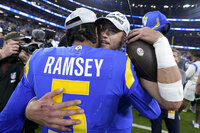 Los Angeles Rams head coach Sean McVay, left, and Matthew Stafford celebrate after the NFC Championship NFL football game against the San Francisco 49ers Sunday, Jan. 30, 2022, in Inglewood, Calif. The Rams won 20-17 to advance to the Super Bowl. (AP Photo/Marcio Jose Sanchez)