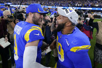 Los Angeles Rams' Van Jefferson, left, and Ben Skowronek celebrate after the NFC Championship NFL football game against the San Francisco 49ers Sunday, Jan. 30, 2022, in Inglewood, Calif. The Rams won 20-17 to advance to the Super Bowl. (AP Photo/Elaine Thompson)