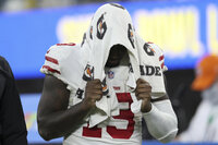 San Francisco 49ers' Deebo Samuel walks off the field after the NFC Championship NFL football game against the Los Angeles Rams Sunday, Jan. 30, 2022, in Inglewood, Calif. The Rams won 20-17 to advance to the Super Bowl. (AP Photo/Jed Jacobsohn)