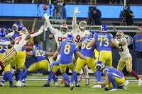 Los Angeles Rams defensive end Aaron Donald, middle, celebrates with teammates during the second half of the NFC Championship NFL football game against the San Francisco 49ers Sunday, Jan. 30, 2022, in Inglewood, Calif. (AP Photo/Jed Jacobsohn)