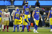 Los Angeles Rams’ David Long Jr. (22), Ernest Jones (50) and Aaron Donald celebrate with teammates after the NFC Championship NFL football game against the San Francisco 49ers Sunday, Jan. 30, 2022, in Inglewood, Calif. The Rams won 20-17 to advance to the Super Bowl. (AP Photo/Mark J. Terrill)