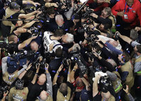 FILE - New England Patriots' Tom Brady holds his daughter, Vivian, after the NFL Super Bowl 53 football game against the Los Angeles Rams, Sunday, Feb. 3, 2019, in Atlanta. Tom Brady has retired after winning seven Super Bowls and setting numerous passing records in an unprecedented 22-year-career. He made the announcement, Tuesday, Feb. 1, 2022, in a long post on Instagram.  (AP Photo/Mark Humphrey, File)