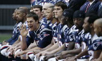 FILE - New England Patriots quarterback Tom Brady holds the Vince Lombardi Trophy after the Patriots beat the Carolina Panthers 32-29 in Super Bowl XXXVIII in Houston, Feb. 1, 2004. Tom Brady has retired after winning seven Super Bowls and setting numerous passing records in an unprecedented 22-year-career. He made the announcement, Tuesday, Feb. 1, 2022, in a long post on Instagram. (AP Photo/Dave Martin, File)