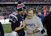 New England Patriots quarterback Tom Brady waves during the team's  picture at the walk through at University of Phoenix Stadium on Saturday, Feb. 2, 2008 in Glendale, Ariz. The Patriots will play the New York Giants in the Super Bowl XLII football game on Sunday, Feb. 3.  (AP Photo/Stephan Savoia)
