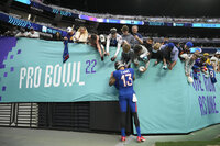 AFC wide receiver Hunter Renfrow, center, of the Las Vegas Raiders, runs the ball against the NFC during the second half of the Pro Bowl NFL football game, Sunday, Feb. 6, 2022, in Las Vegas. (AP Photo/Rick Scuteri)