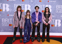 Maneskin poses for photographers upon arrival at the Brit Awards 2022 in London Tuesday, Feb. 8, 2022. (Photo by Joel C Ryan/Invision/AP)