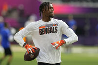 Cincinnati Bengals tight end C.J. Uzomah warms up before the NFL Super Bowl 56 football game against the Los Angeles Rams, Sunday, Feb. 13, 2022, in Inglewood, Calif. (AP Photo/Marcio Jose Sanchez)