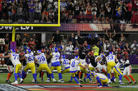 Los Angeles Rams defensive end Aaron Donald, right, celebrates with teammates after the NFL Super Bowl 56 football game against the Cincinnati Bengals, Sunday, Feb. 13, 2022, in Inglewood, Calif. (AP Photo/Elaine Thompson)