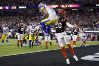 Los Angeles Rams wide receiver Cooper Kupp (10) catches a touchdown against Cincinnati Bengals cornerback Eli Apple (20) during the second half of the NFL Super Bowl 56 football game Sunday, Feb. 13, 2022, in Inglewood, Calif. (AP Photo/Marcio Jose Sanchez)