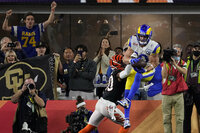 Los Angeles Rams wide receiver Cooper Kupp (10) catches a touchdown against Cincinnati Bengals cornerback Eli Apple (20) during the second half of the NFL Super Bowl 56 football game Sunday, Feb. 13, 2022, in Inglewood, Calif. (AP Photo/Marcio Jose Sanchez)