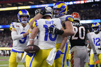 Los Angeles Rams wide receiver Cooper Kupp (10) is congratulated by teammates after scoring a touchdown against the Cincinnati Bengals during the second half of the NFL Super Bowl 56 football game Sunday, Feb. 13, 2022, in Inglewood, Calif. (AP Photo/Marcio Jose Sanchez)