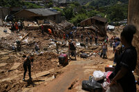 Rescue workers residents and volunteers look for victims in an area affected by landslides in Petropolis, Brazil, Thursday, Feb. 17, 2022.  Deadly floods and mudslides swept away homes and cars, but even as families prepared to bury their dead, it was unclear how many bodies remained trapped in the mud. (AP Photo/Silvia Izquierdo)