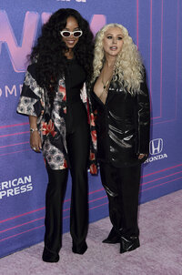 H.E.R. y Christina Aguilera  (Photo by Jordan Strauss/Invision/AP)
