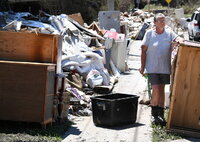 Ipswich (Australia), 08/03/2022.- Goodna resident Lauraine Ormond is seen with her flood damaged belongings outside her house in the suburb of Goodna in Ipswich, Queensland, Australia, 08 March 2022. Queensland is looking at a damage bill of more than 2.5 billion Australian dollar (around 1.687 billion euro) following the flood disaster that has claimed 13 lives. (Inundaciones) EFE/EPA/DARREN ENGLAND AUSTRALIA AND NEW ZEALAND OUT