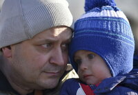 Kyiv (Ukraine), 14/03/2022.- Olexiy holds his son Matviy after they were evacuated from a village nearby Kyiv occupied by the Russian army, to state-controlled territory in Bilihorodka village not far from Kyiv (Kiev), Ukraine, 14 March 2022. Russian troops entered Ukraine on 24 February prompting the country's president to declare martial law and triggering a series of announcements by Western countries to impose severe economic sanctions on Russia. (Atentado, Rusia, Ucrania) EFE/EPA/OLEG PETRASYUK