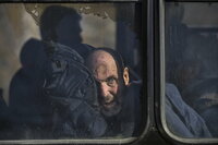 Kyiv (Ukraine), 14/03/2022.- A man looks out a bus window after he was evacuated from a village nearby Kyiv occupied by the Russian army, to state-controlled territory in Bilihorodka village not far from Kyiv (Kiev), Ukraine, 14 March 2022. Russian troops entered Ukraine on 24 February prompting the country's president to declare martial law and triggering a series of announcements by Western countries to impose severe economic sanctions on Russia. (Atentado, Rusia, Ucrania) EFE/EPA/OLEG PETRASYUK