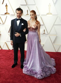 Gian Luca Passi de Preposulo, left, and Jessica Chastain arrive at the Oscars on Sunday, March 27, 2022, at the Dolby Theatre in Los Angeles. (Photo by Jordan Strauss/Invision/AP)
