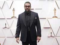 Jason Momoa arrives at the Oscars on Sunday, March 27, 2022, at the Dolby Theatre in Los Angeles. (AP Photo/Jae C. Hong)
