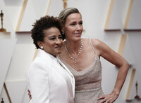 Wanda Sykes, left, and Alex Sykes arrive at the Oscars on Sunday, March 27, 2022, at the Dolby Theatre in Los Angeles. (AP Photo/Jae C. Hong)