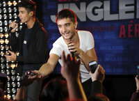 The Wanted's Tom Parker reaches out to the crowd during a performance at Z100's Jingle Ball 2012 kickoff event presented by Aeropostale on Friday, Oct. 19, 2012 in New York. (Photo by Evan Agostini/Invision/AP)