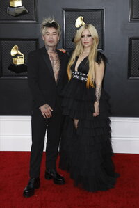Avril Lavigne, left, and Mod Sun arrive at the iHeartRadio Music Awards on Tuesday, March 22, 2022, at the Shrine Auditorium in Los Angeles. (Photo by Jordan Strauss/Invision/AP)