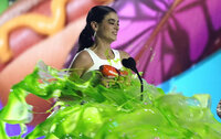 Dixie D'Amelio gets slimed as she accepts the award for favorite social music star at the Kids Choice Awards on Saturday, April 9, 2022, at the Barker Hangar in Santa Monica, Calif. (AP Photo/Chris Pizzello)