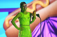 Dixie D'Amelio gets slimed as she accepts the award for favorite social music star at the Kids Choice Awards on Saturday, April 9, 2022, at the Barker Hangar in Santa Monica, Calif. (AP Photo/Chris Pizzello)