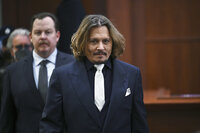 US actor Johnny Depp walks into the courtroom during the $50 million Depp vs Heard deformation trail at the Fairfax County Circuit Court April 12, 2022, in Fairfax, Virginia. (Photo by Brendan SMIALOWSKI / POOL / AFP)