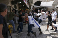 Palestinians and Jewish youths clash in Jerusalem's Old City as Israelis mark Jerusalem Day, an Israeli holiday celebrating the capture of the Old City during the 1967 Mideast war. Sunday, May 29, 2022. Israel claims all of Jerusalem as its capital. But Palestinians, who seek east Jerusalem as the capital of a future state, see the march as a provocation. Last year, the parade helped trigger an 11-day war between Israel and Gaza militants. (AP Photo/Ariel Schalit)