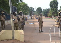 Ougadougou (Burkina Faso), 30/09/2022.- People gather on a street in Ouagadougou, Burkina Faso, 30 September 2022. Gunshots have been heard near the presidential palace in Ouagadougou with what some residents claim to be an alleged coup attempt. Access has been blocked by the military to some government buildings including the national assembly and the national broadcaster. In January 2022 the current head of state, Lt-Col Paul-Henri Damiba, ousted President Roch Kabore through a coup. Lieutenant Colonel Paul-Henri Damiba has called for calm. (Golpe de Estado) EFE/EPA/ASSANE OUEDRAOGO