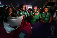 Fans crowd the FIFA Fan Festival site in Doha, Qatar, Saturday, Nov. 19, 2022. Authorities turned away thousands of fans Saturday night from a concert celebrating the World Cup beginning the next day in Qatar, showing the challenges ahead for Doha as it tries to manage crowds in FIFA's most-compact tournament ever. (AP Photo/Jon Gambrell)
