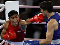 Silver medalist Mexico's Marco Verde poses during a medals ceremony for the men's 71 kg final boxing match at the 2024 Summer Olympics, Friday, Aug. 9, 2024, in Paris, France. (AP Photo/Ariana Cubillos)